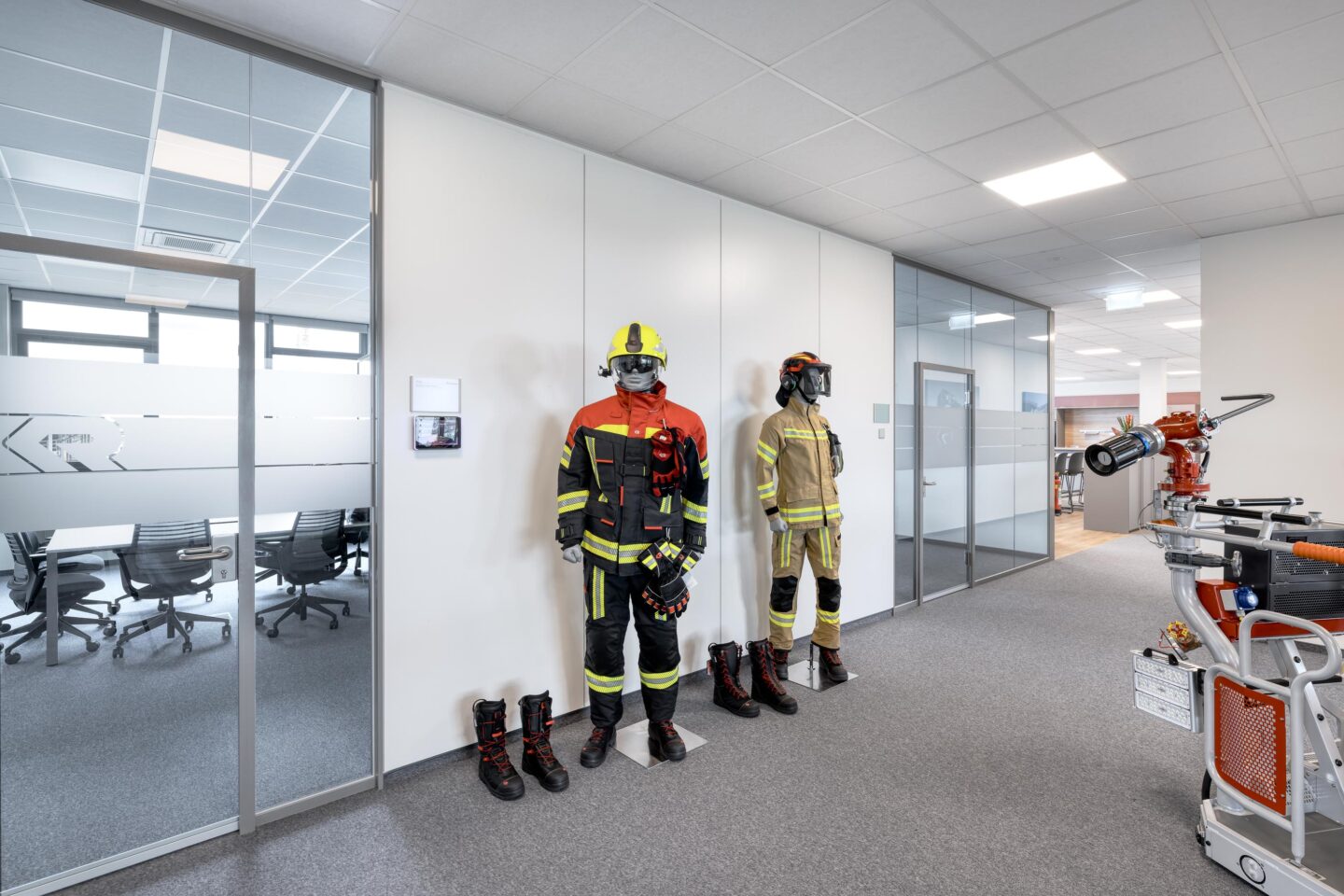 Rosenbauer Karlsruhe GmbH | fire fighter uniforms displayed in front of fecowall