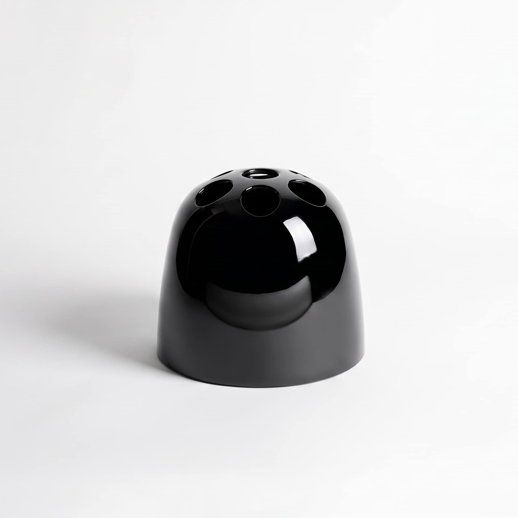 artemide-dedalo-schirmstaender-schwarz Schwarzer Artemide Dedalo Schirmständer aus glänzendem Kunststoff im Profil